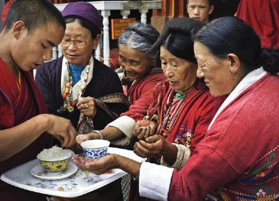 Monks and visitors at a monastery