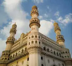 The minarets of the Charminar against a blue sky