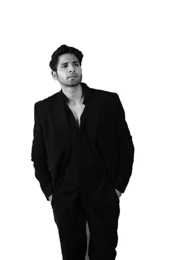 Black-and-white portrait of Vaibhav Tatwawadi standing