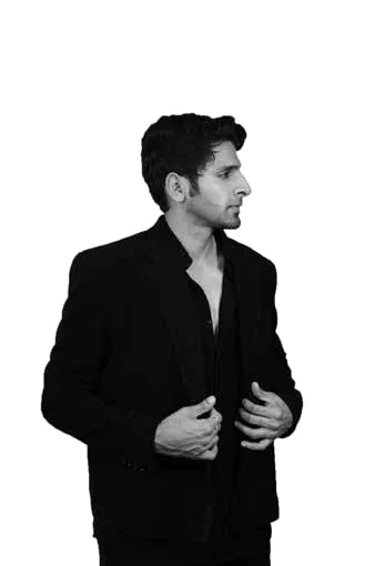 Black-and-white portrait of Vaibhav Tatwawadi in a suit