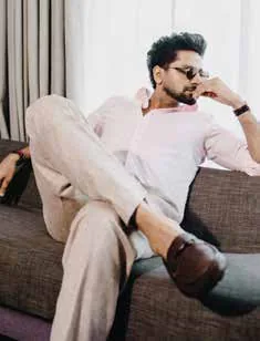 Vaibhav Tatwawadi seated on a sofa