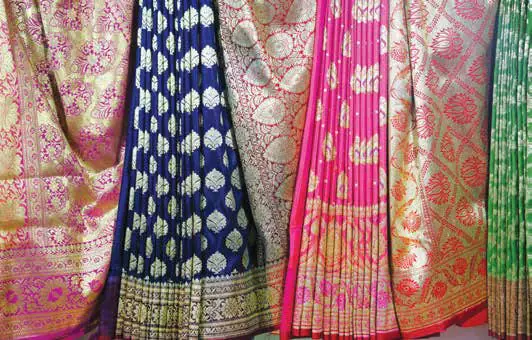 Brightly coloured silk saris with woven patterns