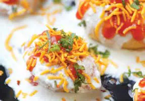 A plate of chaat topped with sev