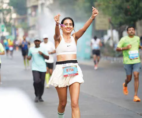 Vineeta Singh running in a race among other runners