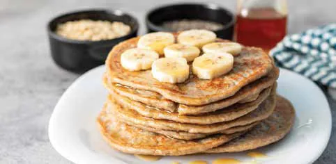 A stack of banana pancakes on a plate