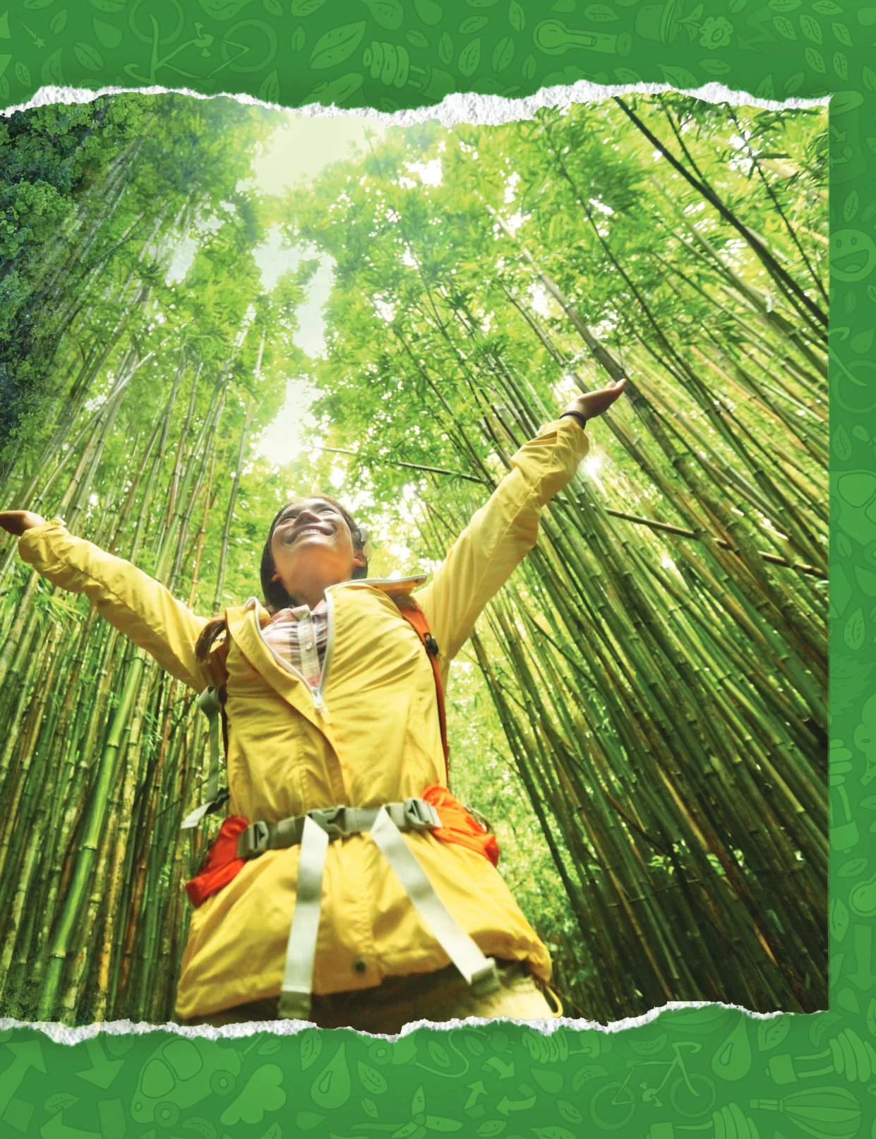A woman with arms outstretched in a bamboo forest