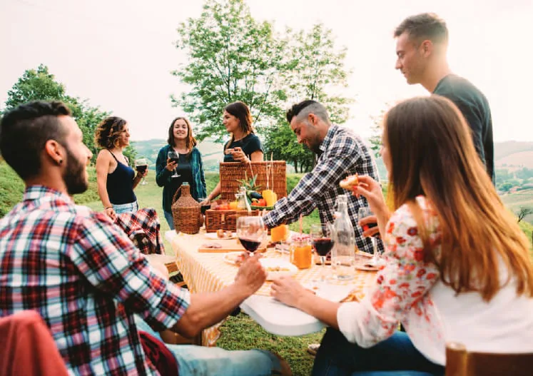 Friends at an outdoor picnic table