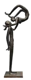 A slender metal sculpture of a dancing figure