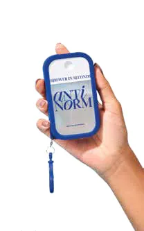 A hand holding a small blue body cleanser pouch