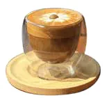 A latte in a glass cup on a wooden saucer