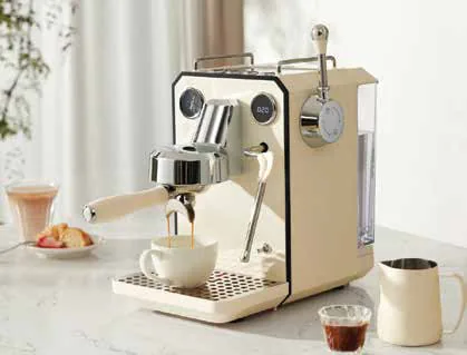 A cream-coloured espresso machine on a kitchen counter with cups