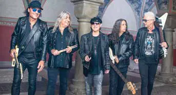 The members of Def Leppard posing together