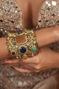 A gem-set cuff bracelet on a wrist