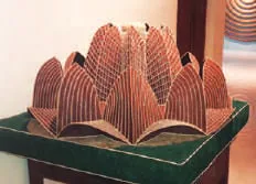A carved wooden object shaped like a lotus